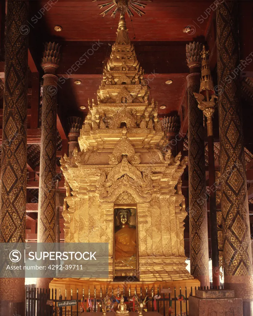 Interior of wat Phra That Lampang Luang, Lampang, with a typical northern ""Ku"" housing the main Buddha image. Lampang,Thailand.