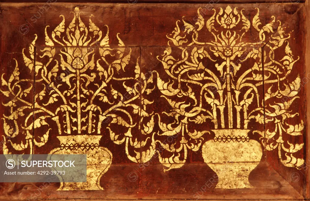 A motif of golden bodhi trees painted on the wooden panels of Wat Pong Yang Khok, Lampang. early 19th century.Thailand.