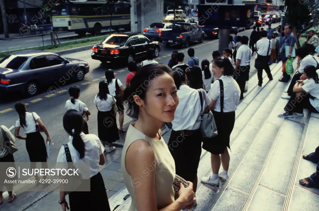 Students waiting for the bus in Bangkok