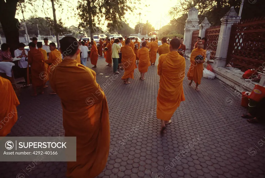 Monks collecting alms. Bangkok, Thailand