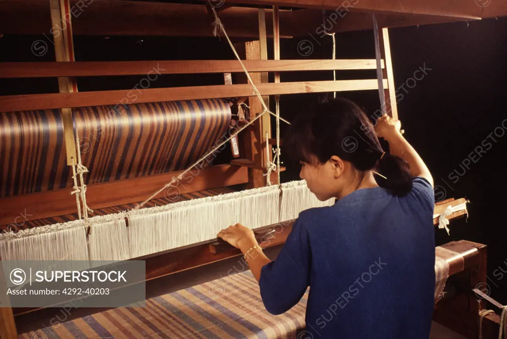 Woman working at loom