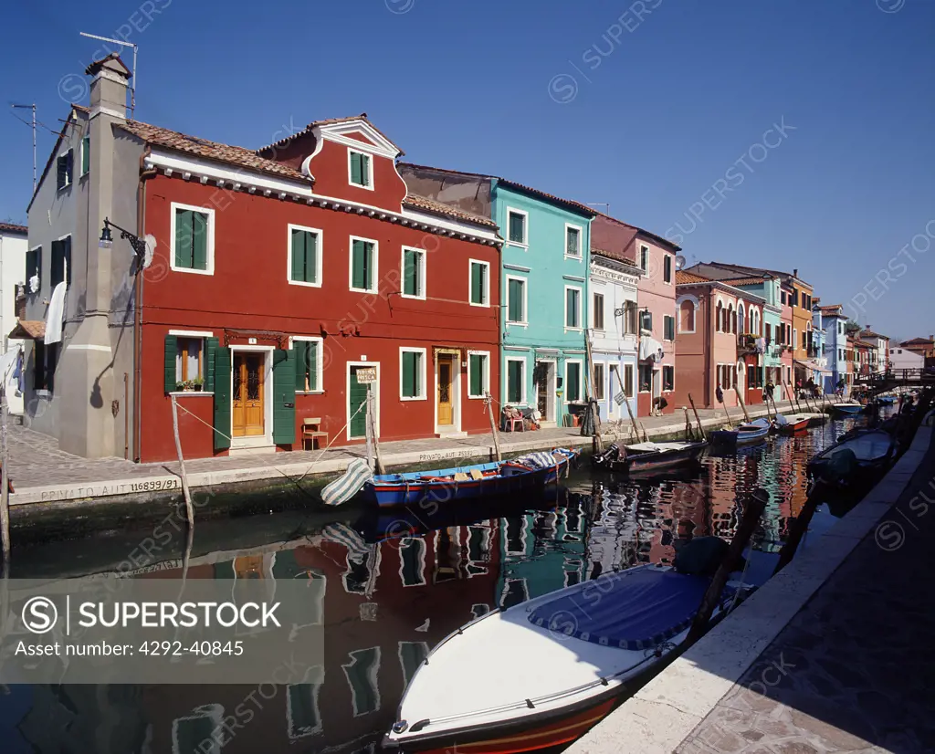 Italy, Island of Burano. Colorful fishermans houses and canal