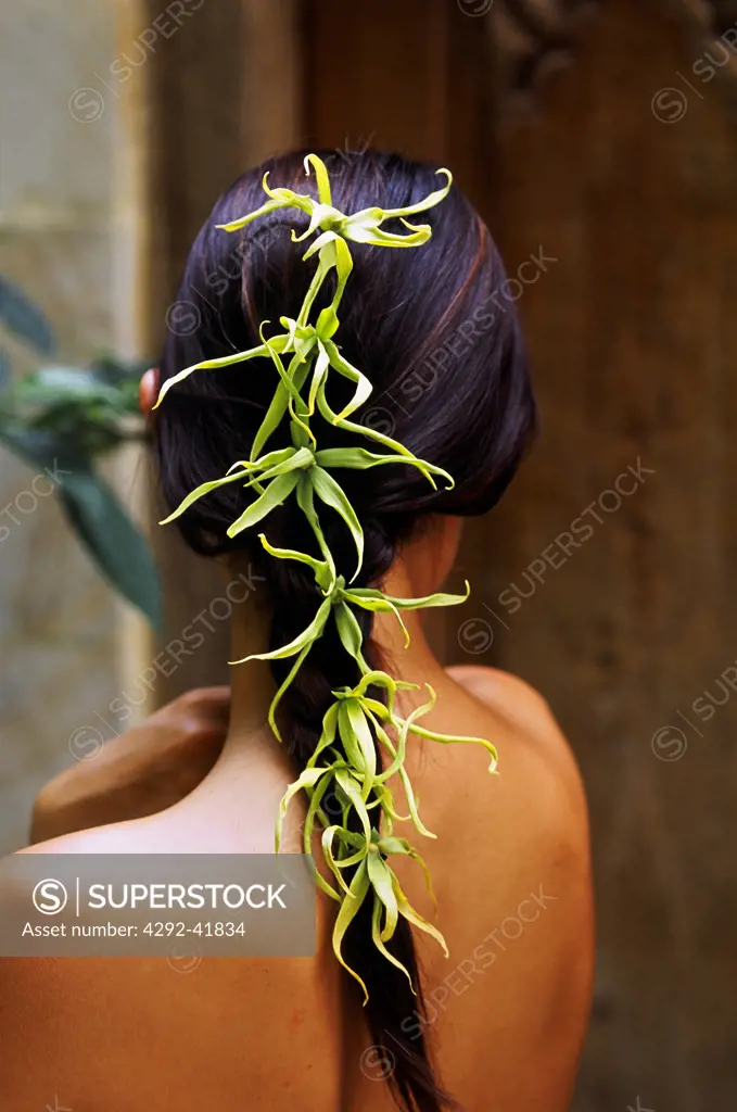 Woman with ylang ylang in her hair