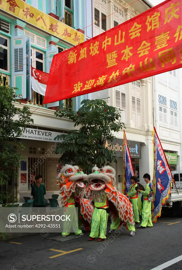Shophouses on Keong Saik Road in Singapore and Lion Dancers