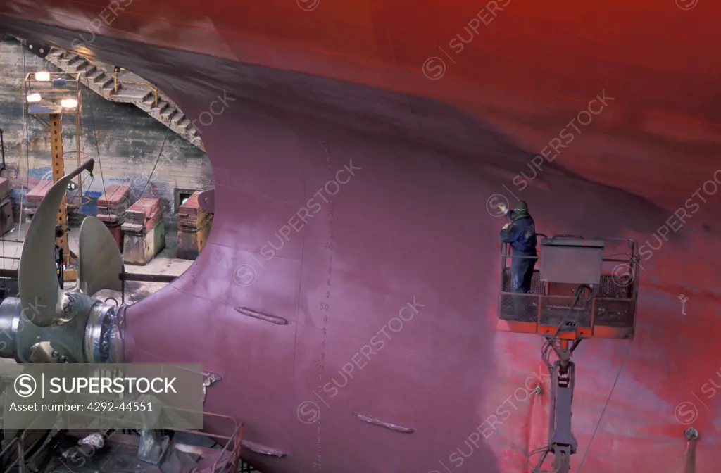 Worker welding a keel