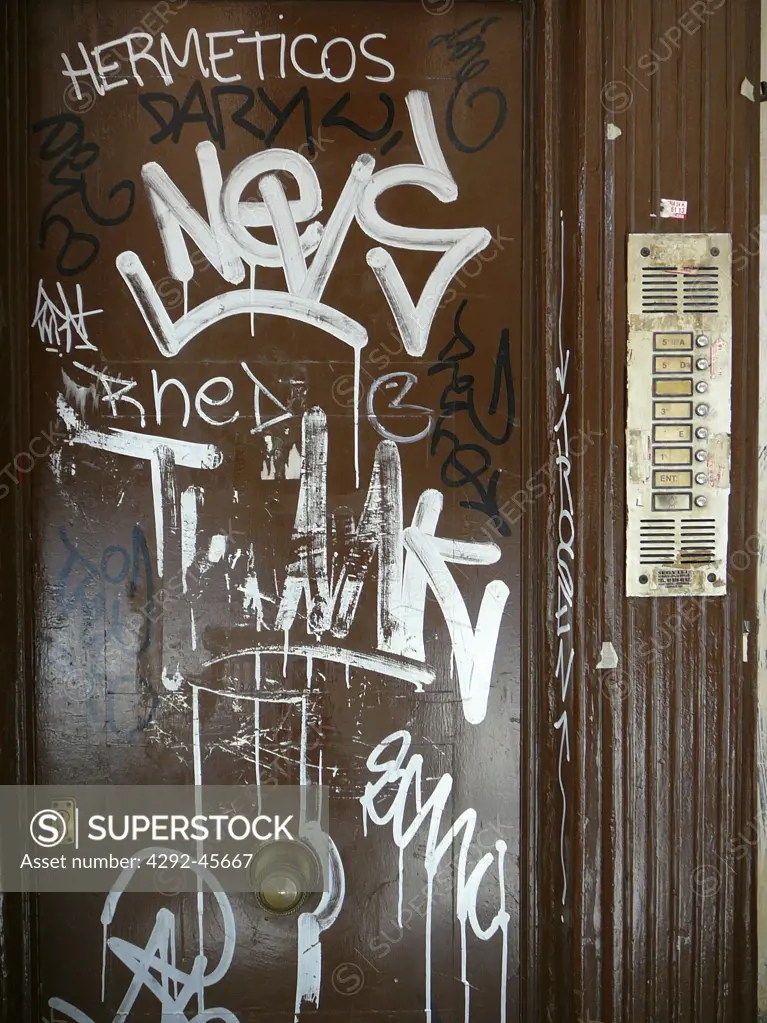 Door with Grafitti.Plaza Mayor, Madrid, Spain