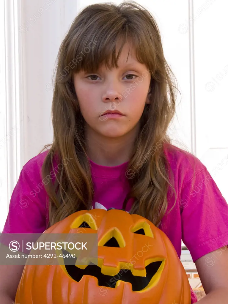 Girl with pumpkin