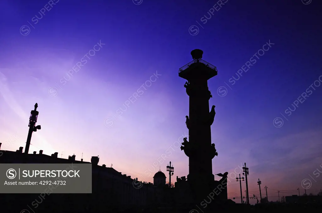 Russia, St. Petersburg at sunset, in the background one of the Rostral Columns