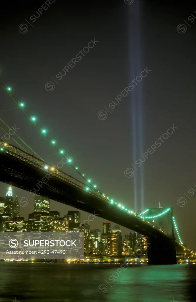 9/11 memorial lights. Brooklyn Bridge skyline. New York, USA