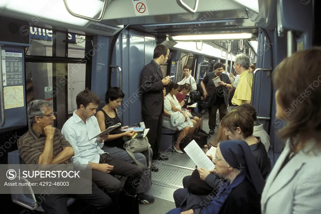 People in metro, Paris, France