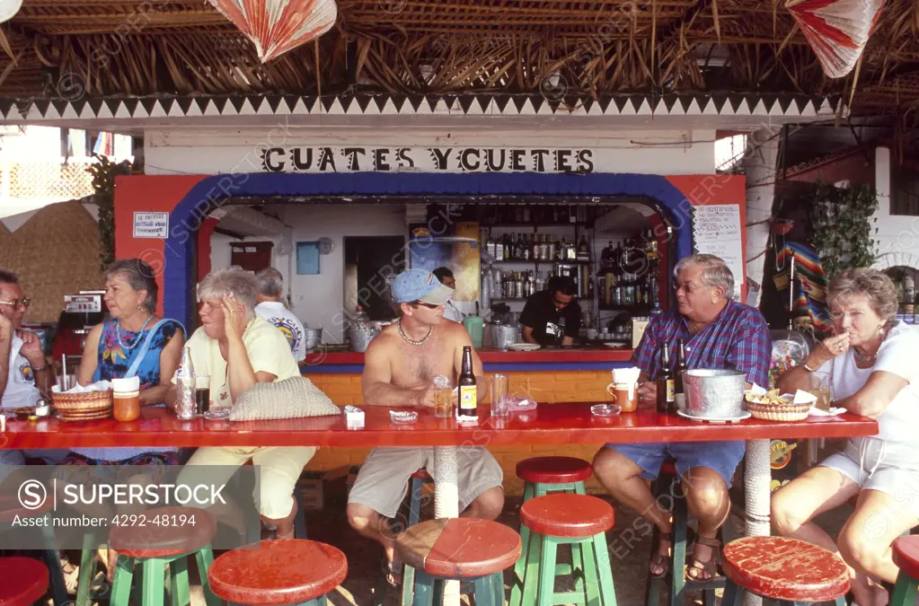 Mexico, Los Muertos beach, Puerto Vallarta.People at cafe