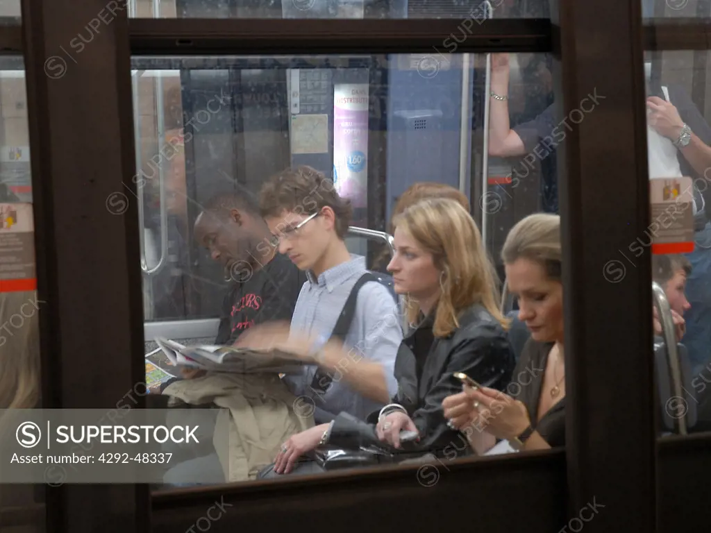 Commuters, in subway, Paris, France