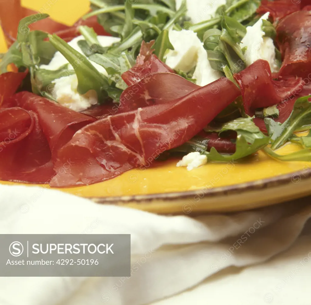 Bresaola (dried beef) with parmesan cheese and rucola