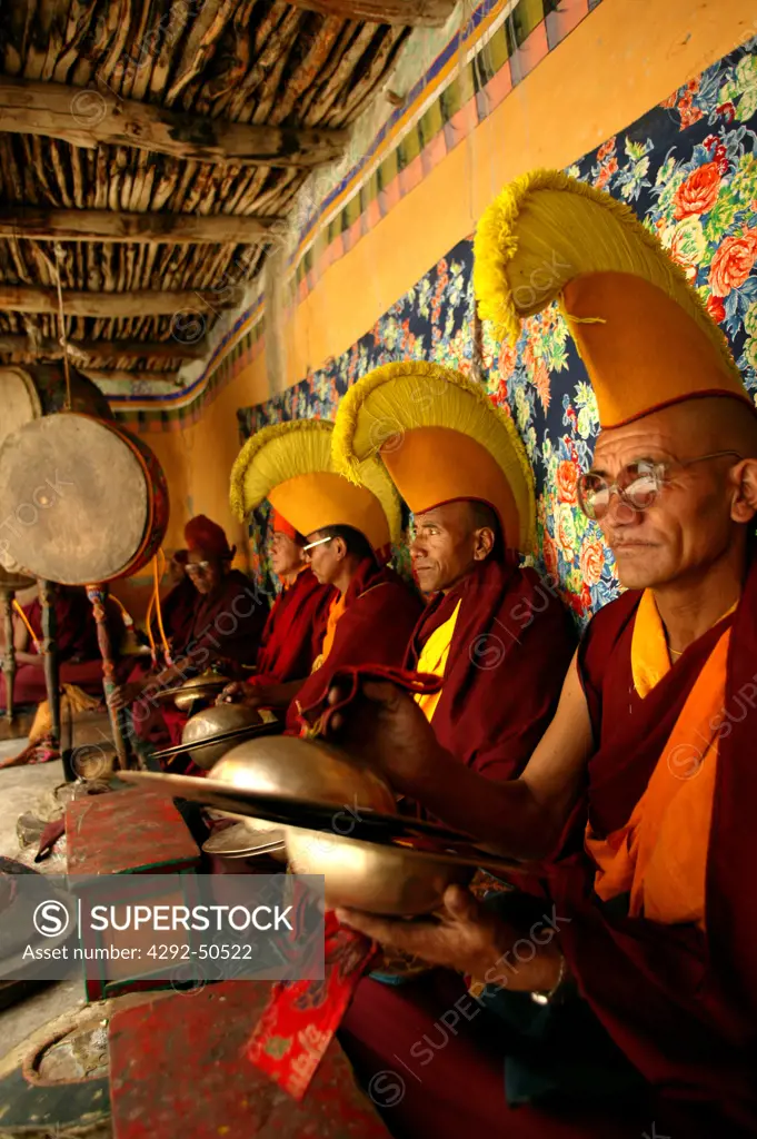 Buddhist monks playing music in temple