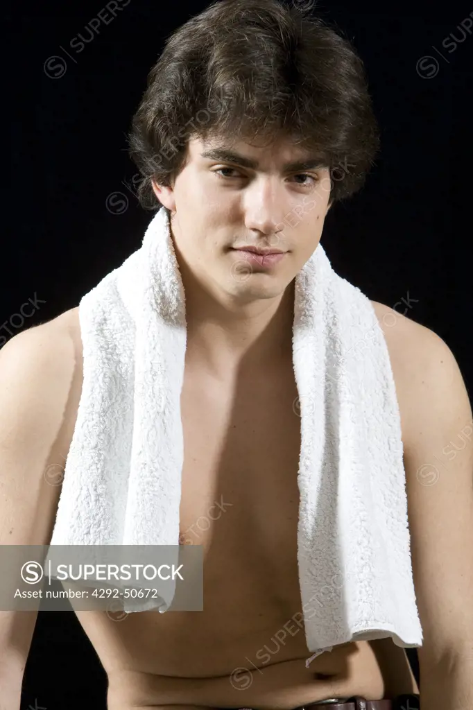 Young man with towel around neck