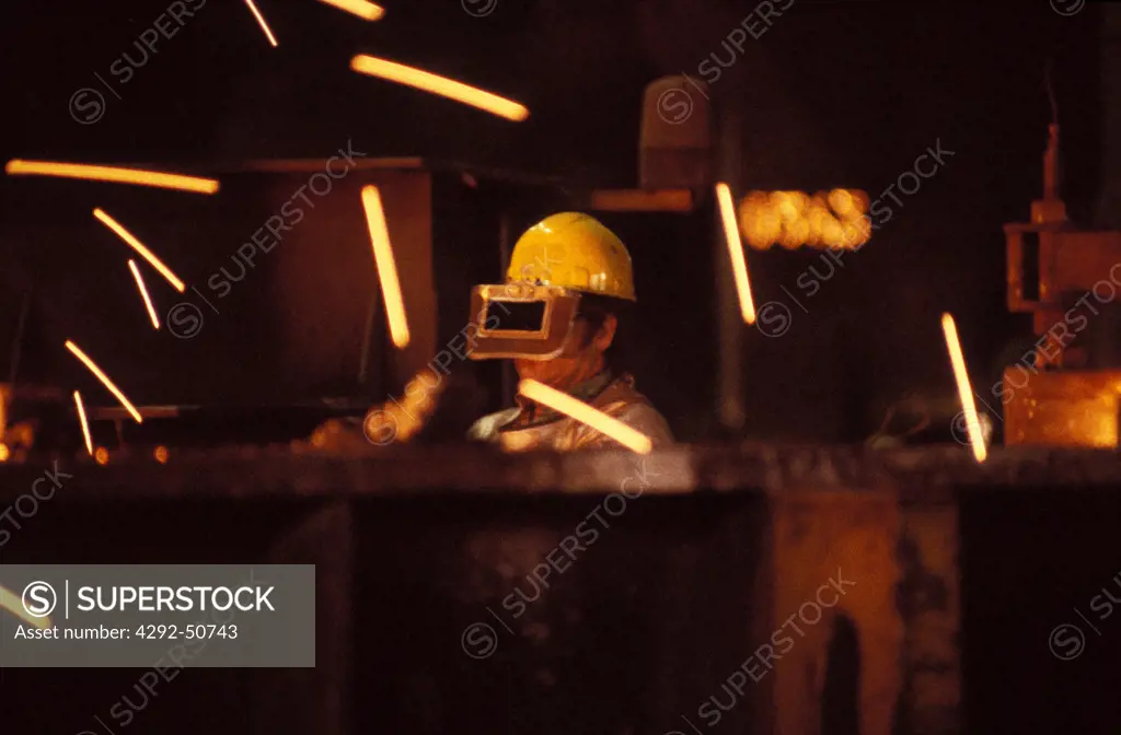 Worker in steel mill