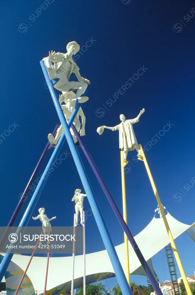 Sculptures of walkers on stilts
