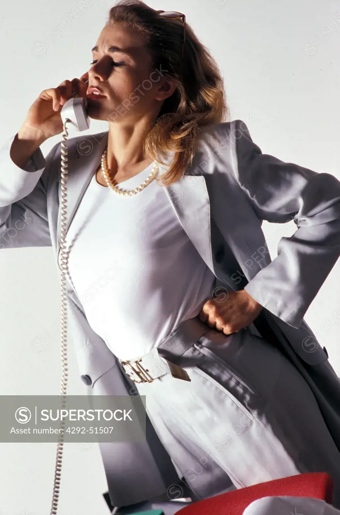Businesswoman speaking at the phone in office