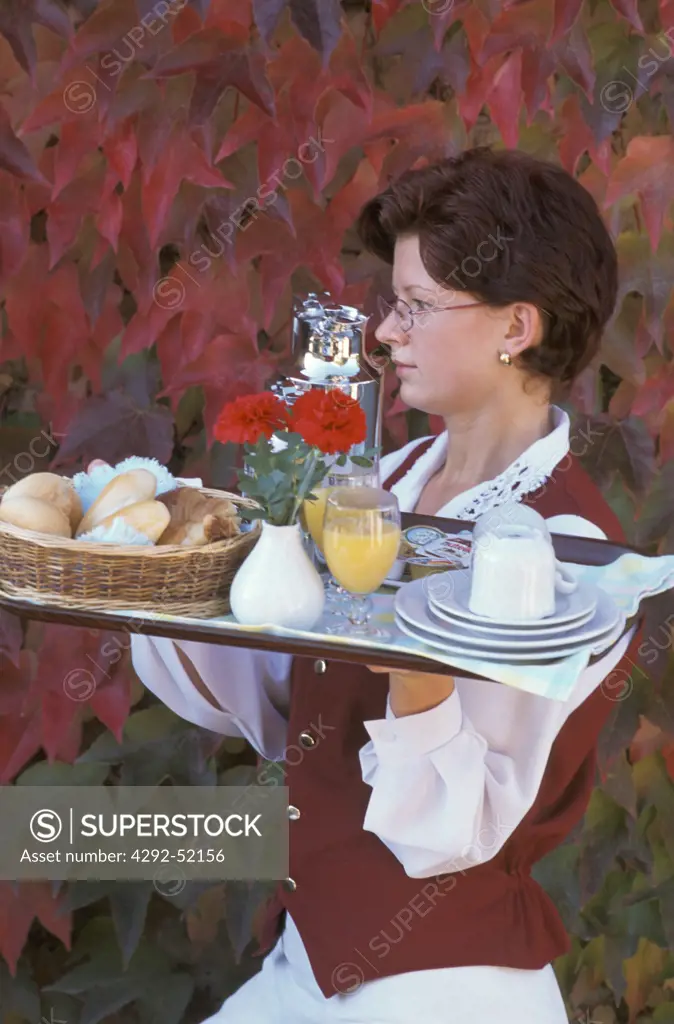 Waitress serving breakfast