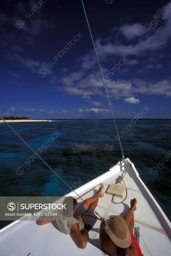 Tonga, couple on boat to Malinoa atoll
