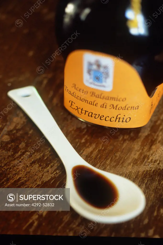 Emilia Romagna, Modena, Bottle and tasting spoon of balsamic vinegar