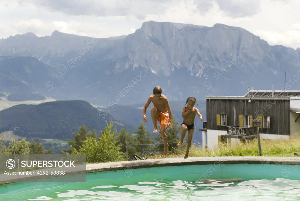 Italy, Trentino Alto Adige, Barbiano, Children in the swimmingpool at Hotel