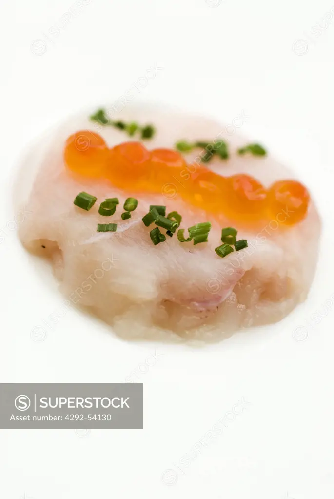 Carpaccio of seabass marinated with ginger and salmon eggs