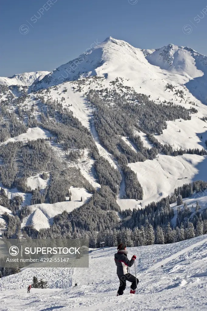Austria, Tyrol, Alpbach valley, skier and Galtenberg Mount