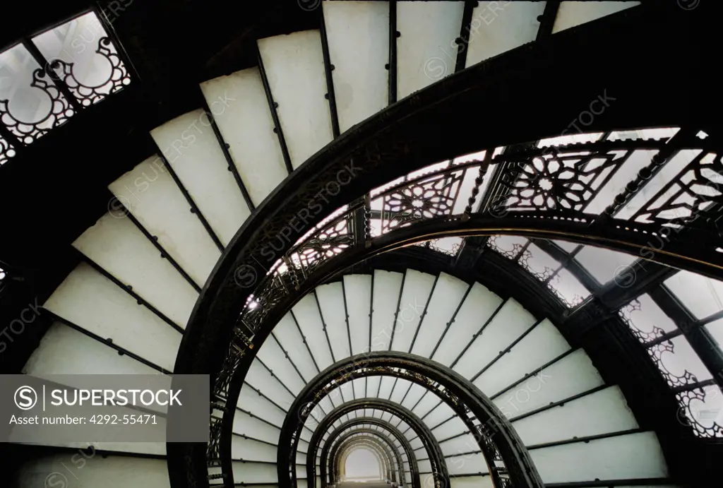 A view of the spiral staircase, decorated with Root's intricate iron-work, in The Rookery, Chicago,USA