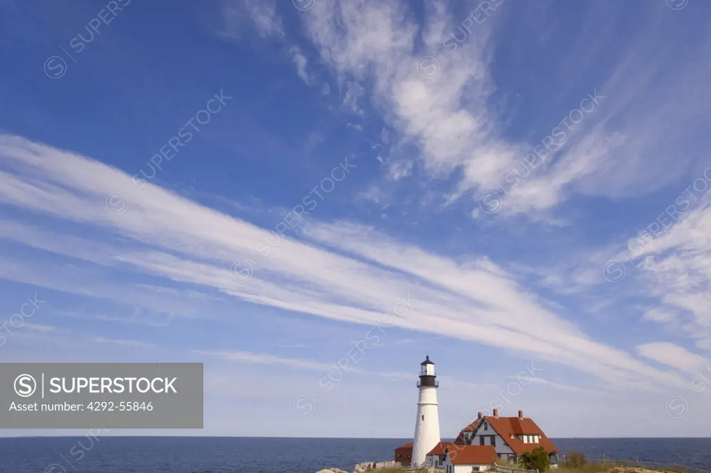 Usa, Maine, lighthouse and passing schooner Portland Head Cape Elizabeth