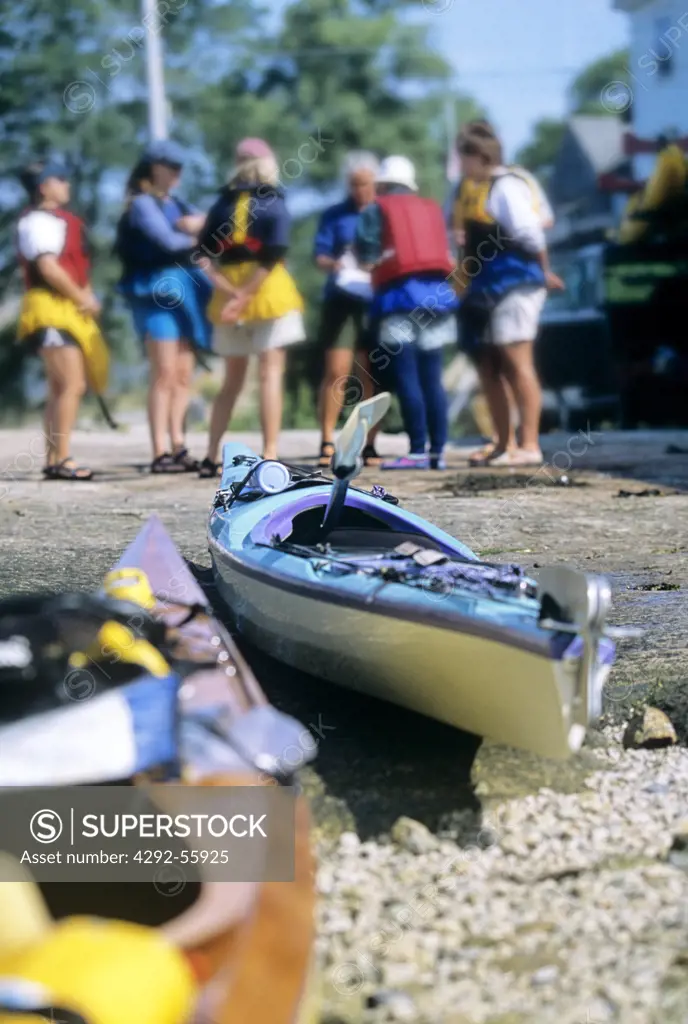 Group of women preparing for a kayak trip in Deer Island Thorofare. Stonington, Maine,USA