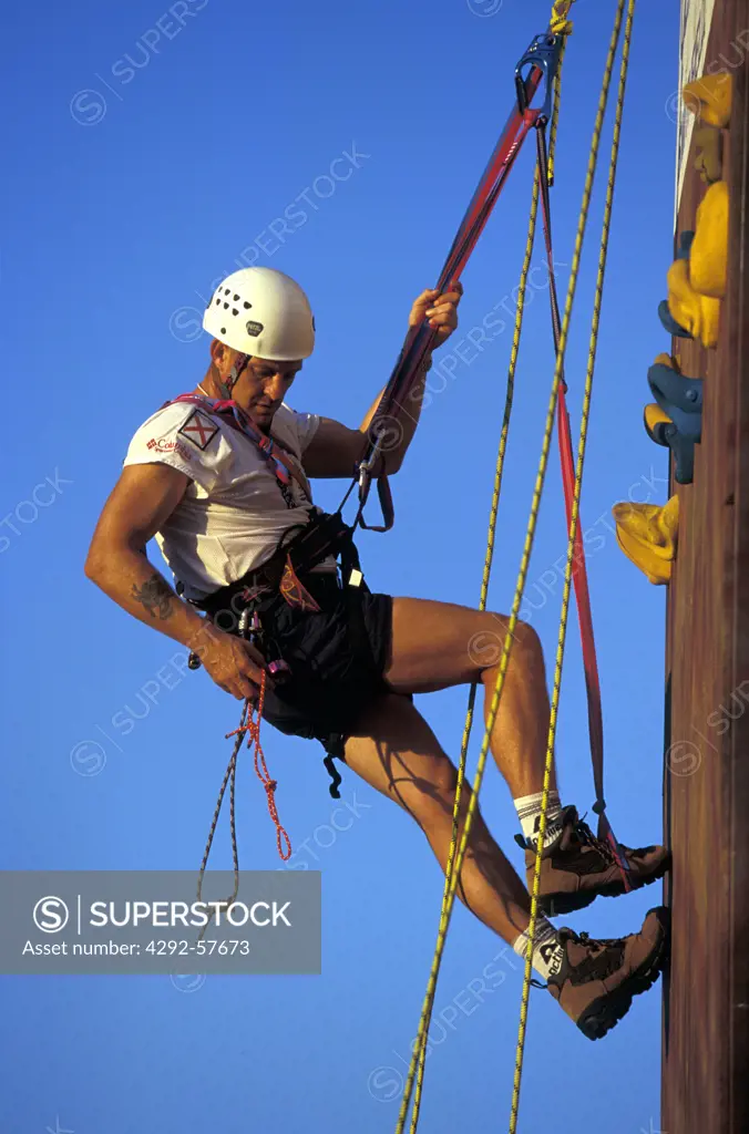 Climbing, man on training wall