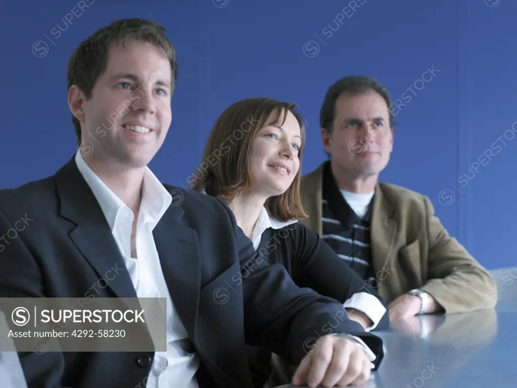 Business Executives sitting in a boardroom at a meeting