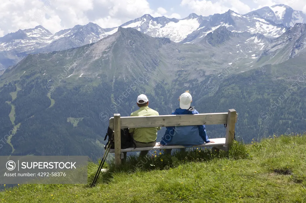 Austria, Bad Gastein, Stubnerkogel, Hiker Rstting on a Bench.