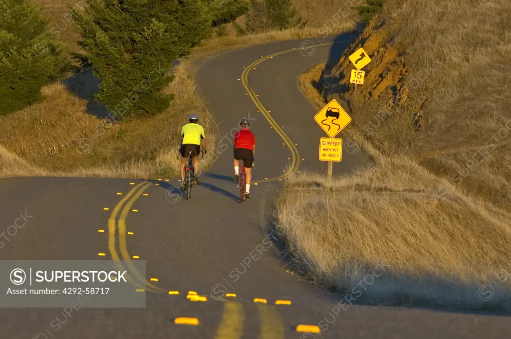Bicycle riders on country road , Northern California,USA