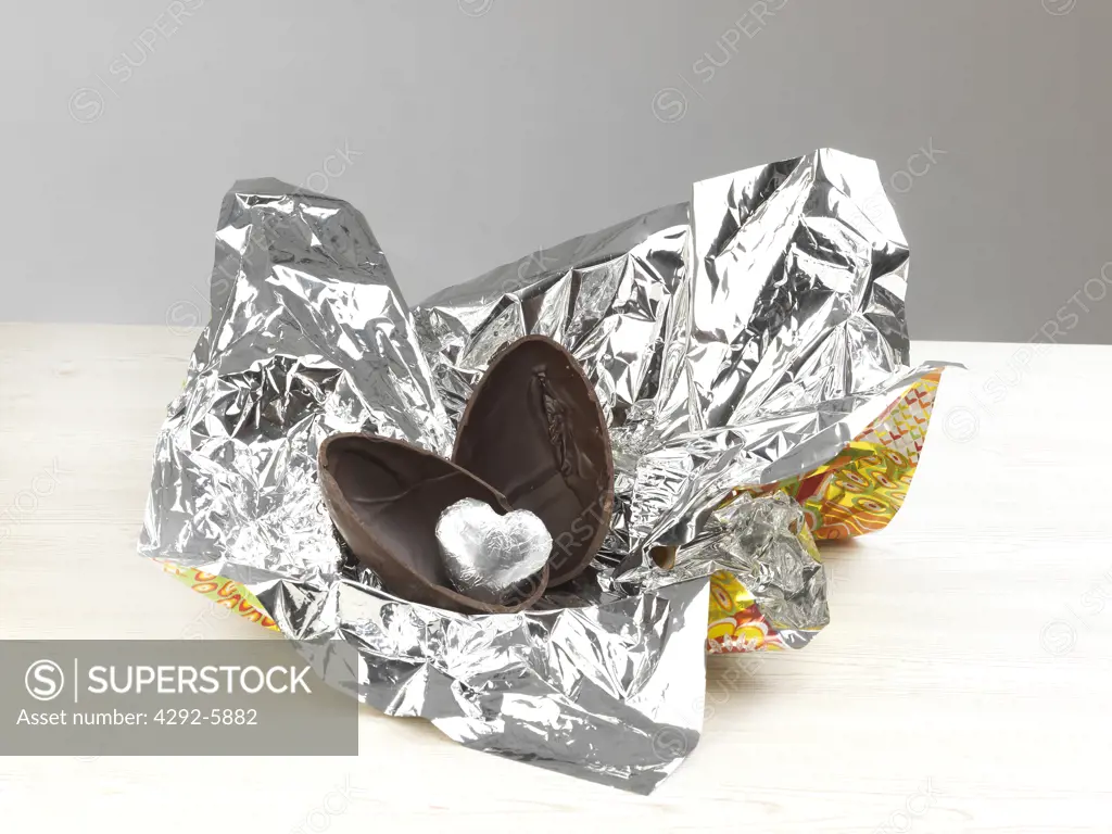 Easter chocolate egg with silver heart as surprise