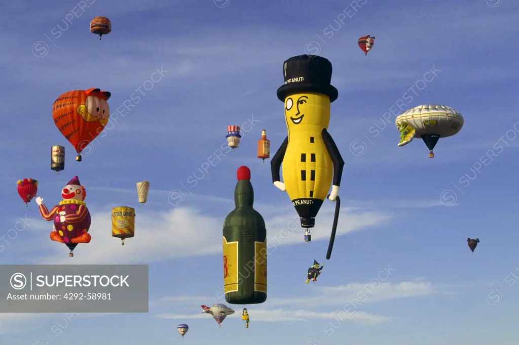 USA, New Mexico, Albuquerque: blue sky filled with sponsored colorful special shape balloons at Hot Air Balloon Festival