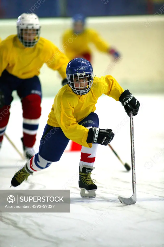 Boy playing ice hockey