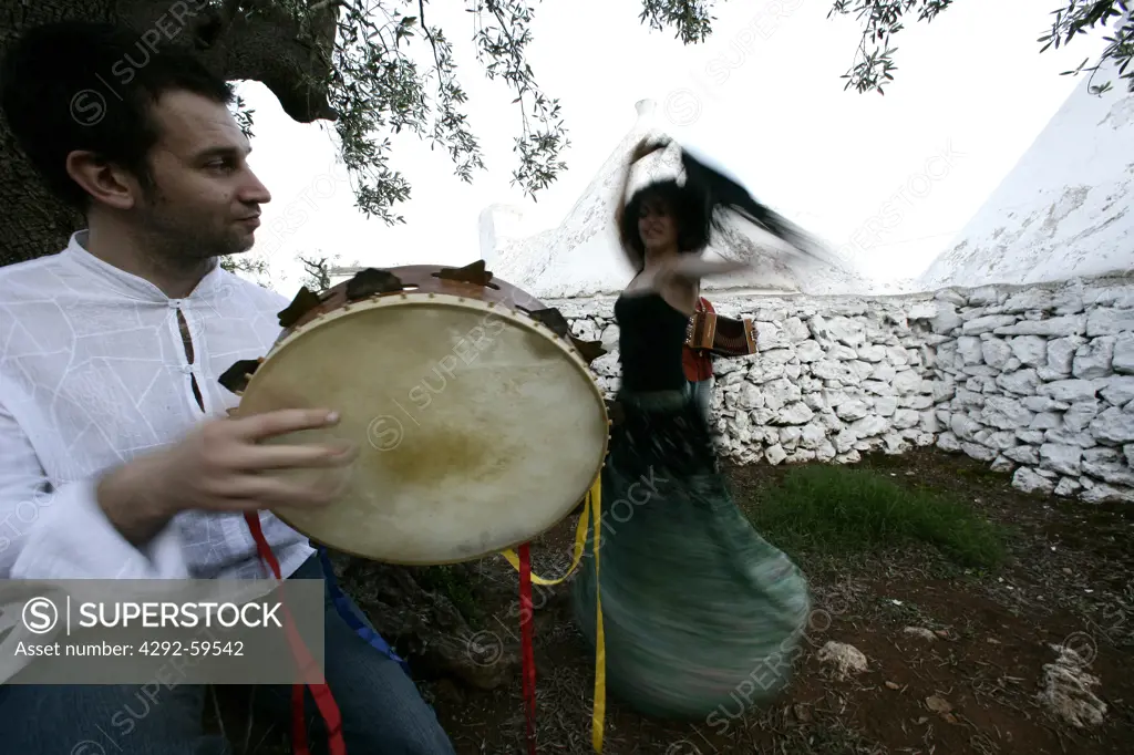People dancing pizzica (traditional dance)