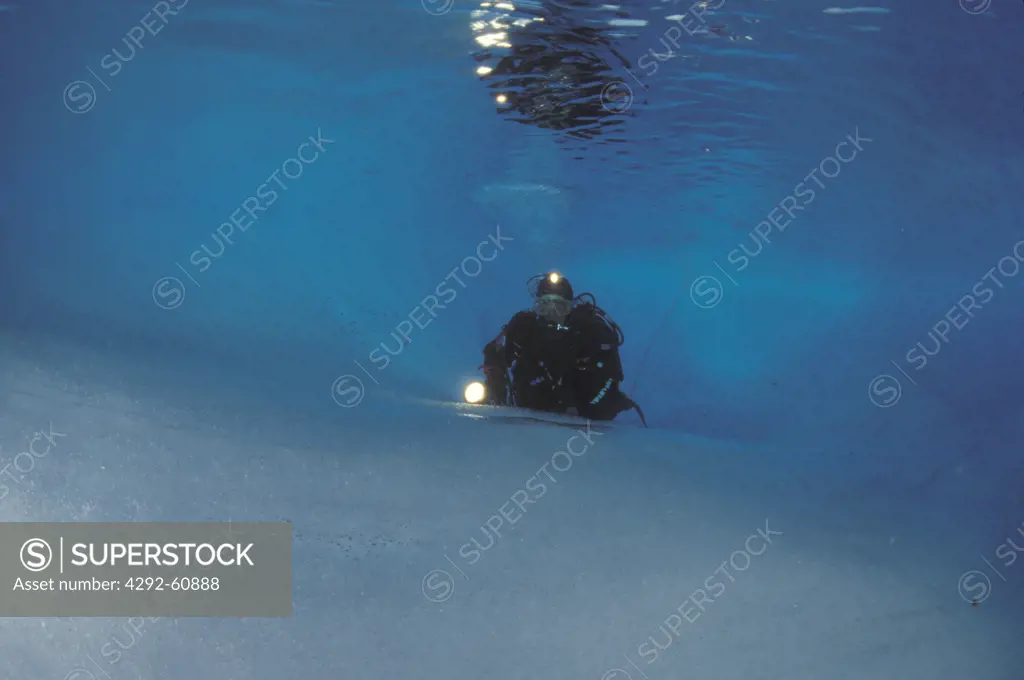 Diver under ice