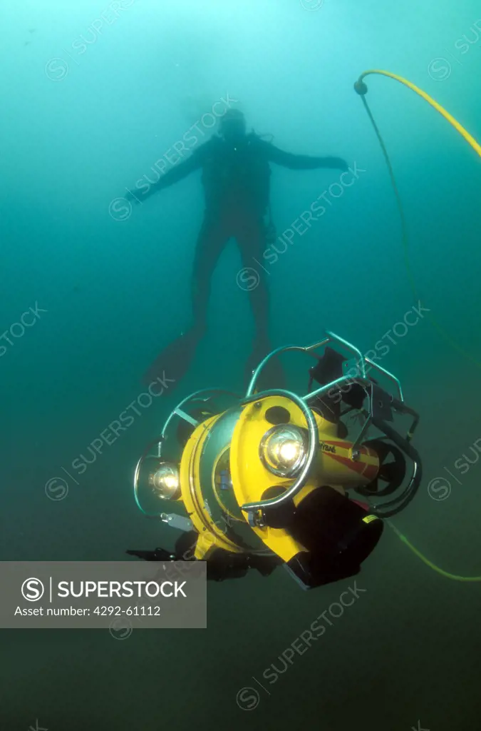 Diver with underwater robot camera