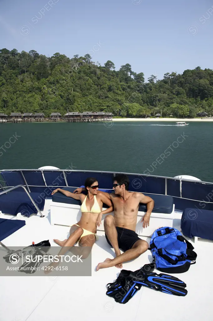 Couple on boat at Pangkor Laut Resort in Malaysia