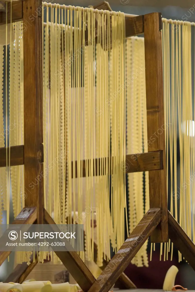 Home-made pasta hanging up to dry