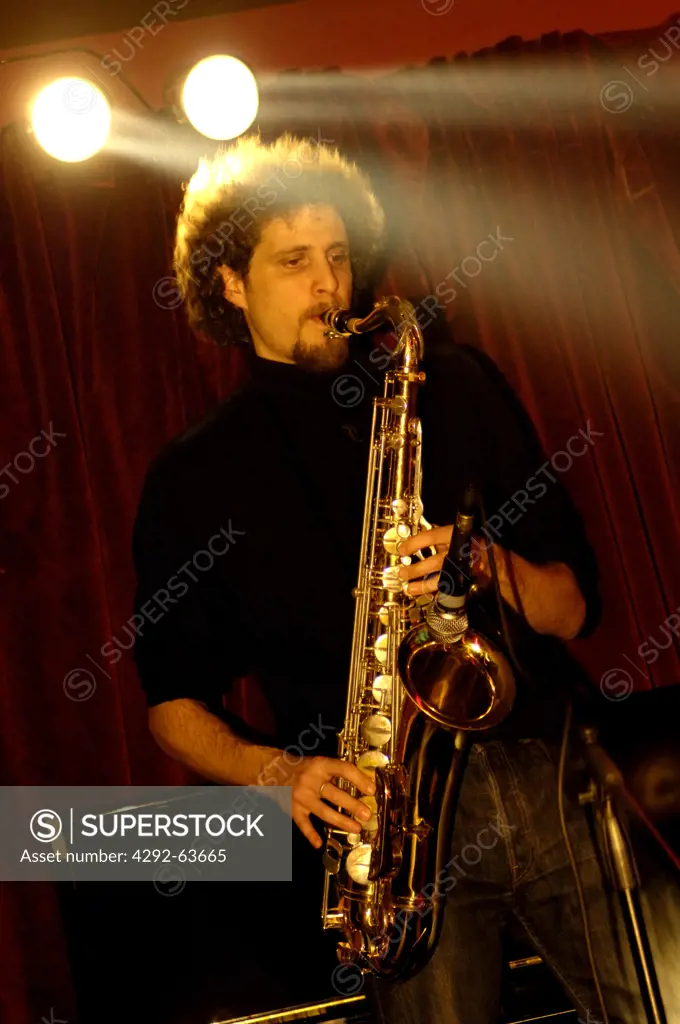 Man playing saxophone during a live concert