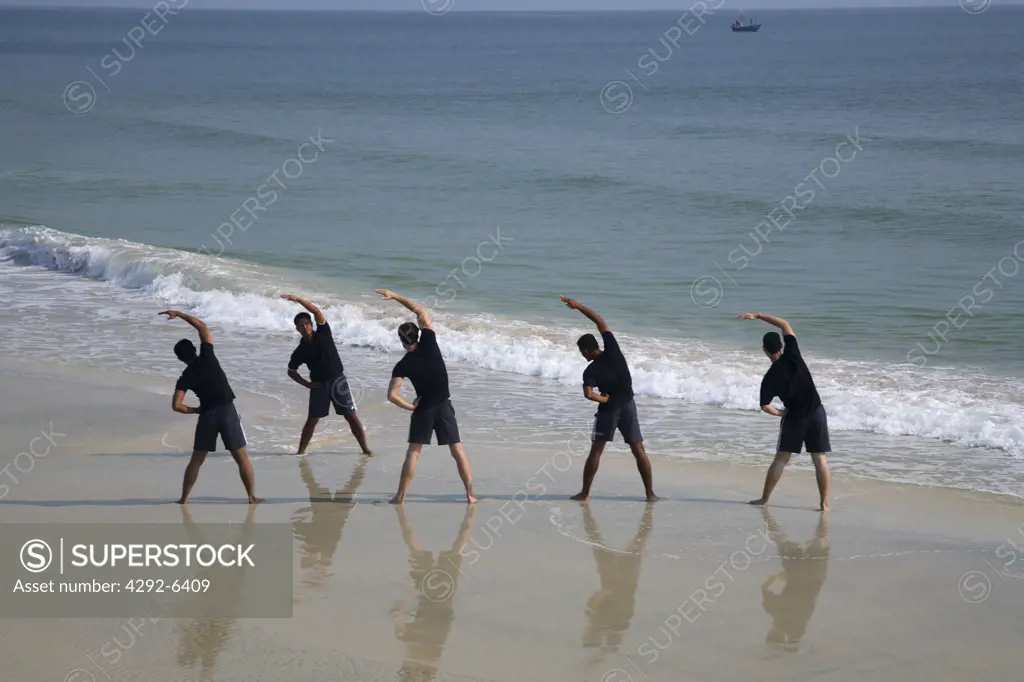 Group of people exercising on the beachin Hua Hin, Thailand