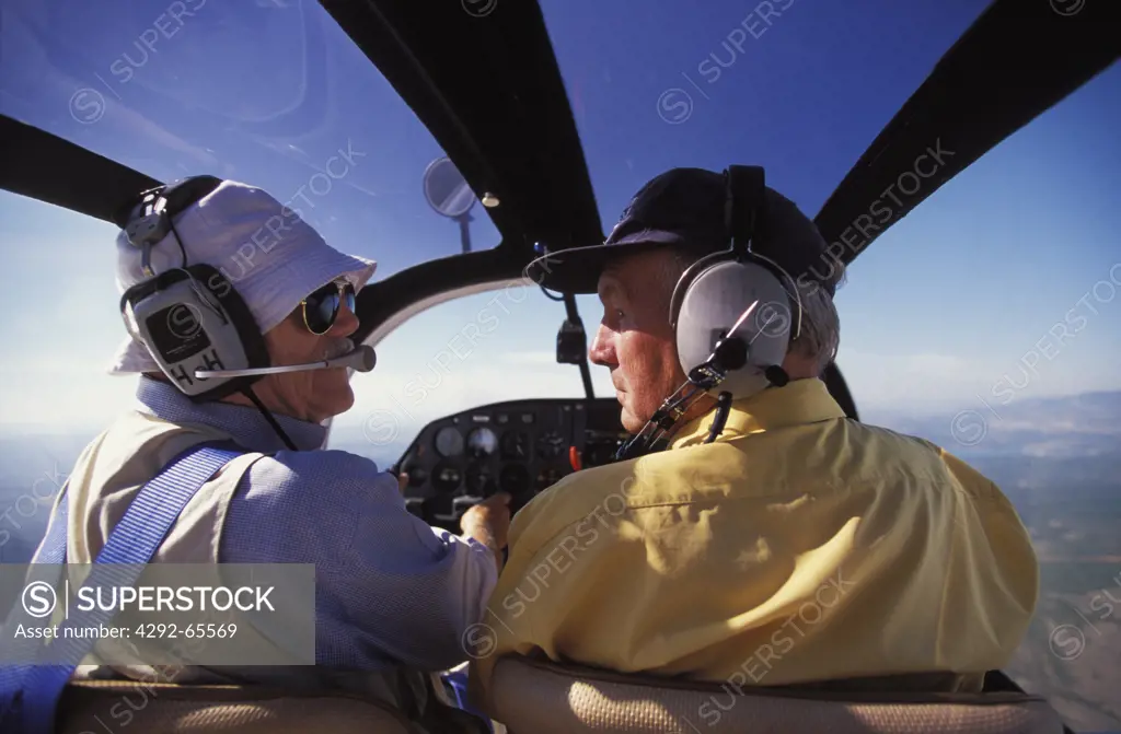 Seniors in airplane's cockpit