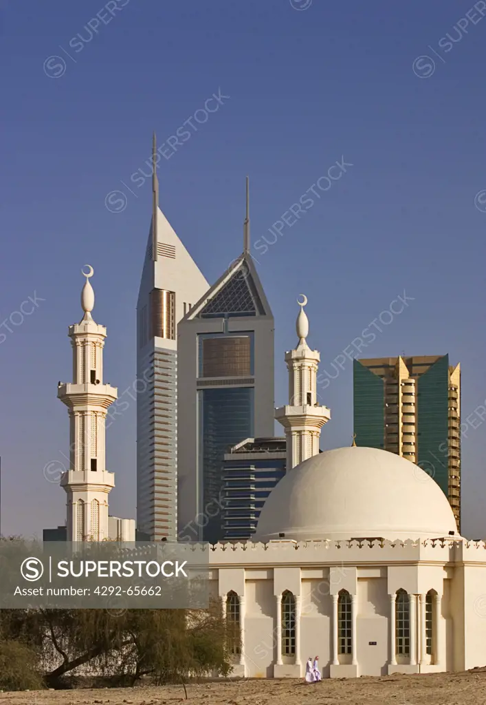 Dubai, United Arab Emirates, modern buildings on Sheikh Zayed Road, the Abu Dhabi Road, with mosque in foreground