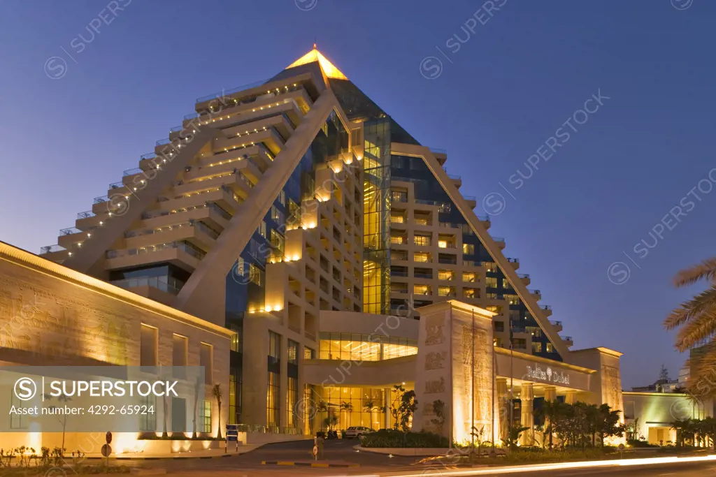 United Arab Emirates, Dubai, Raffles Hotel built on an Egyptian theme and adjacent to the Wafi Mall, a luxurious shopping centre Evening.