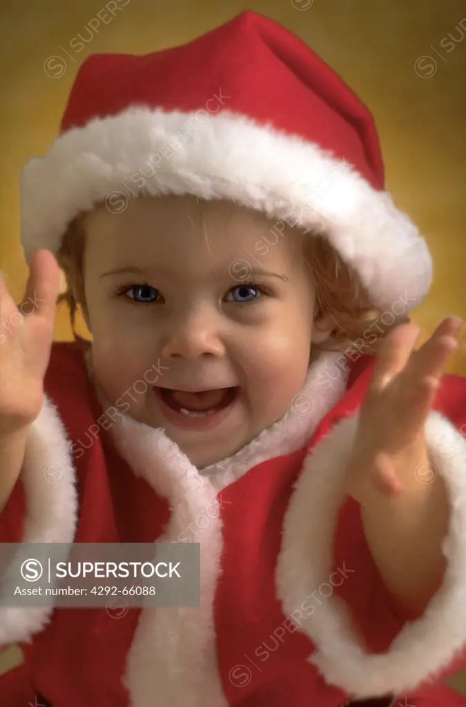 Little girl with Santa Claus costume