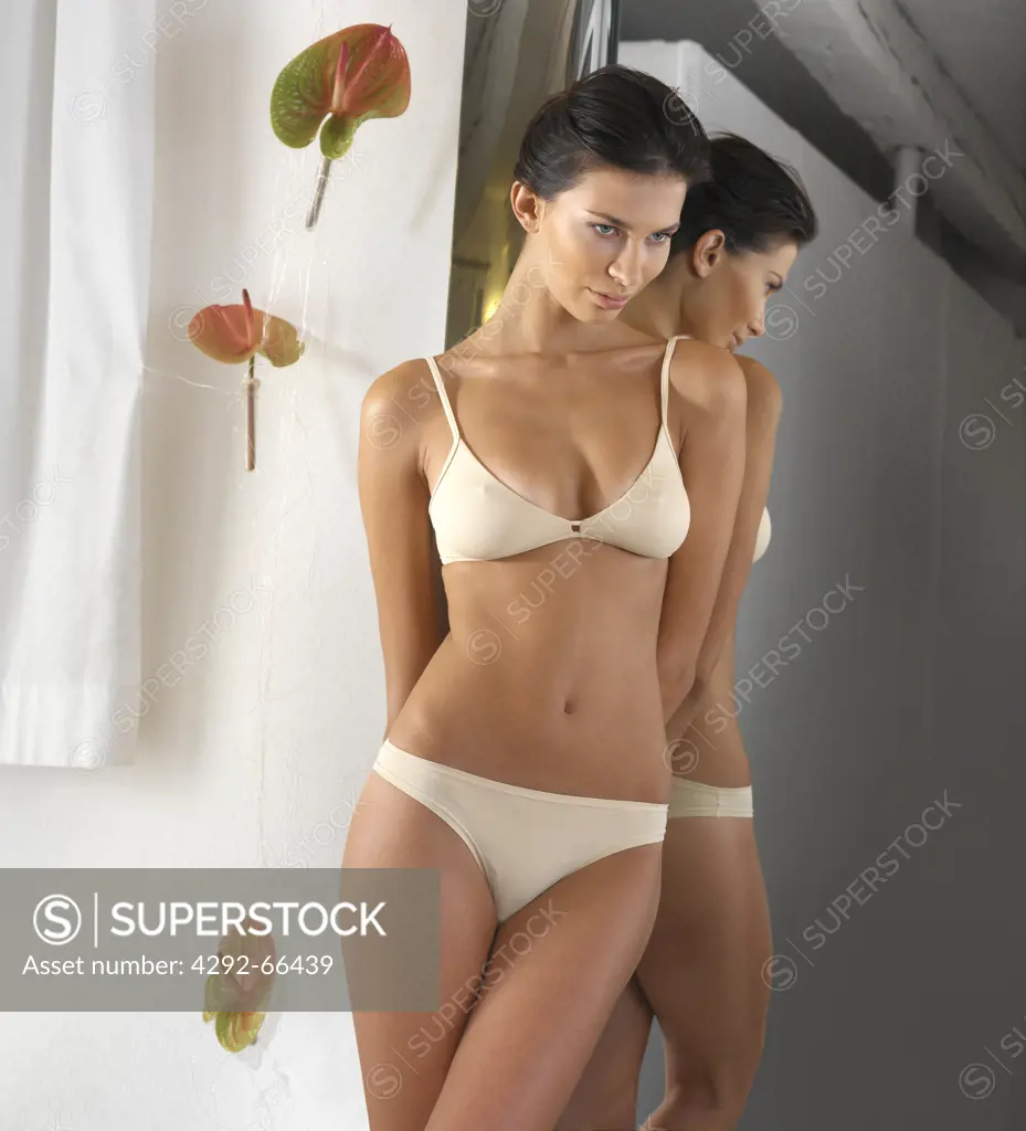 Sexy young woman wearing lingerie - SuperStock